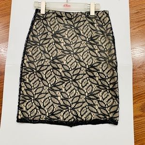 Ann Taylor petite faux leather lace skirt with stretch lining.Great for holidays